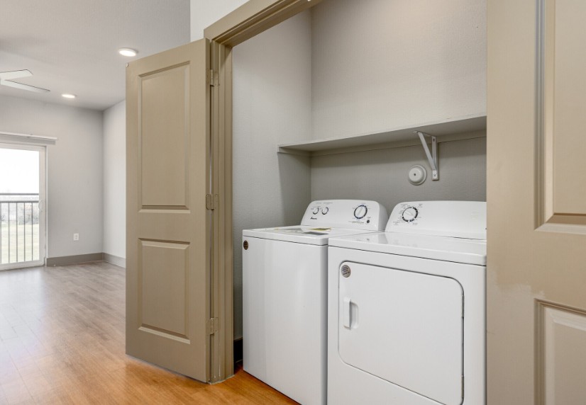 A laundry room with a washer and dryer.